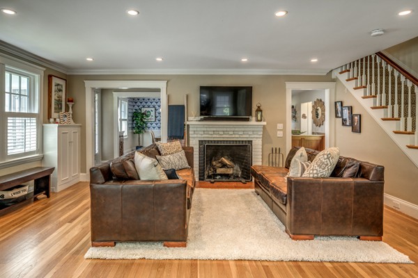 832 Webster Street Needham, MA 02492 - Photo 6 of 28 a living room with fireplace furniture and a flat screen tv