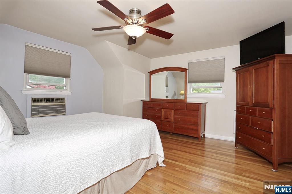 87 Barbara Road Dumont, NJ 07628 - Photo 30 of 48 a bed room with a bed and a television
