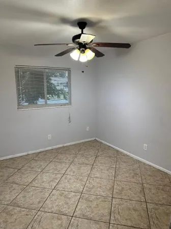 a view of an empty room with a window