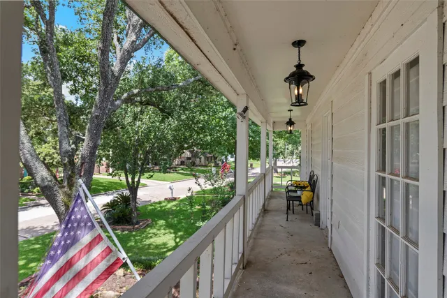 a view of a porch and garden
