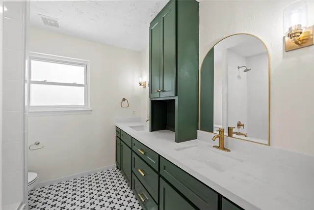 a bathroom with a double vanity sink and a mirror