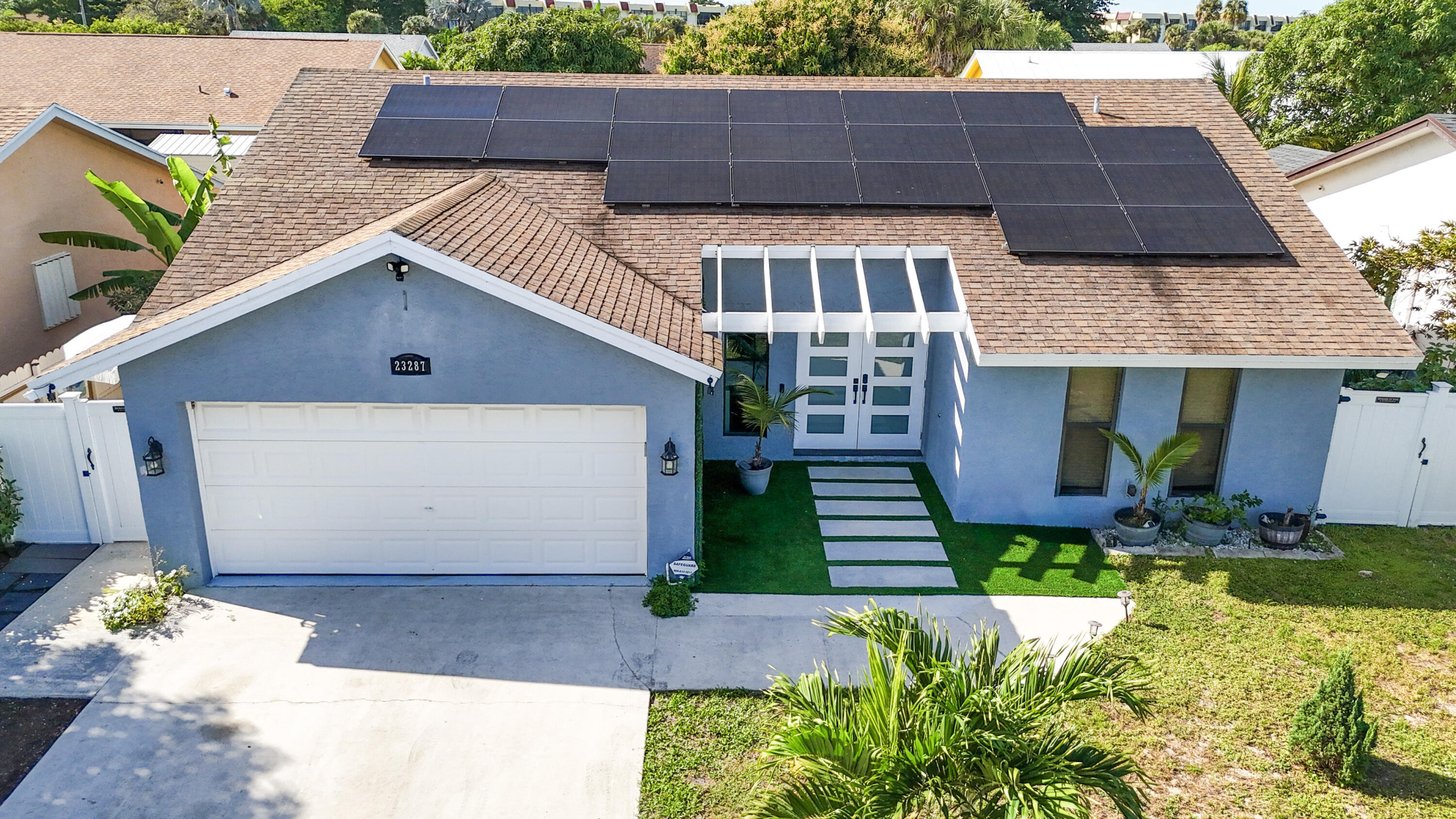 a front view of a house with a yard