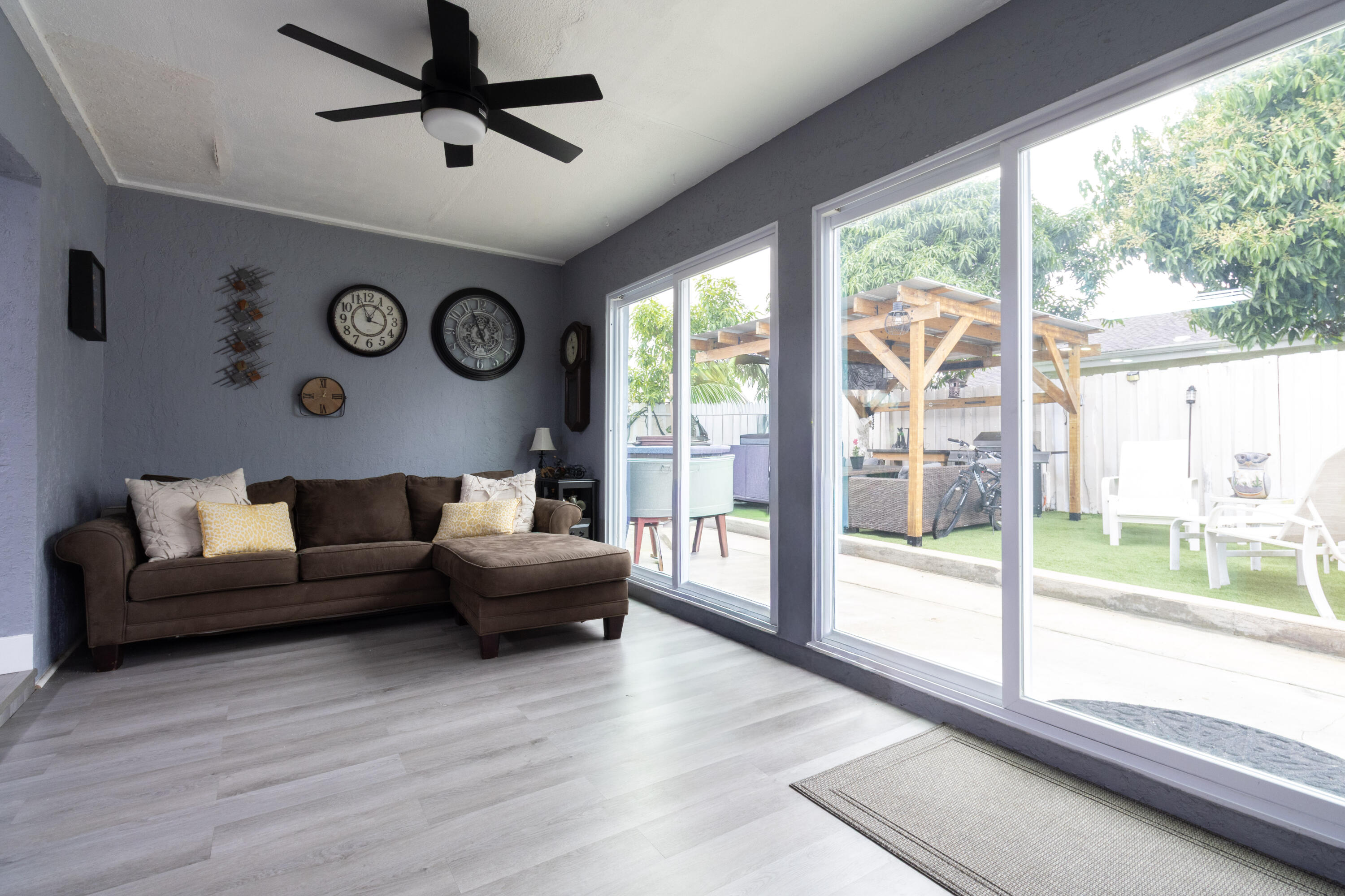 23287 Southwest 60th Avenue Boca Raton, FL 33428 - Photo 16 of 43 a living room with furniture and a large window