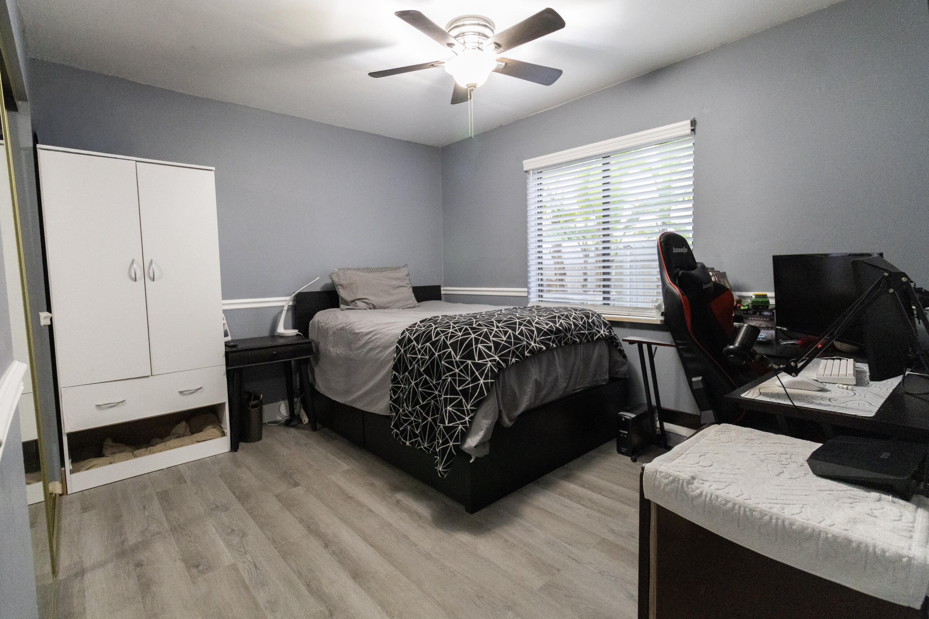 23287 Southwest 60th Avenue Boca Raton, FL 33428 - Photo 20 of 43 a bedroom with a bed and a desk