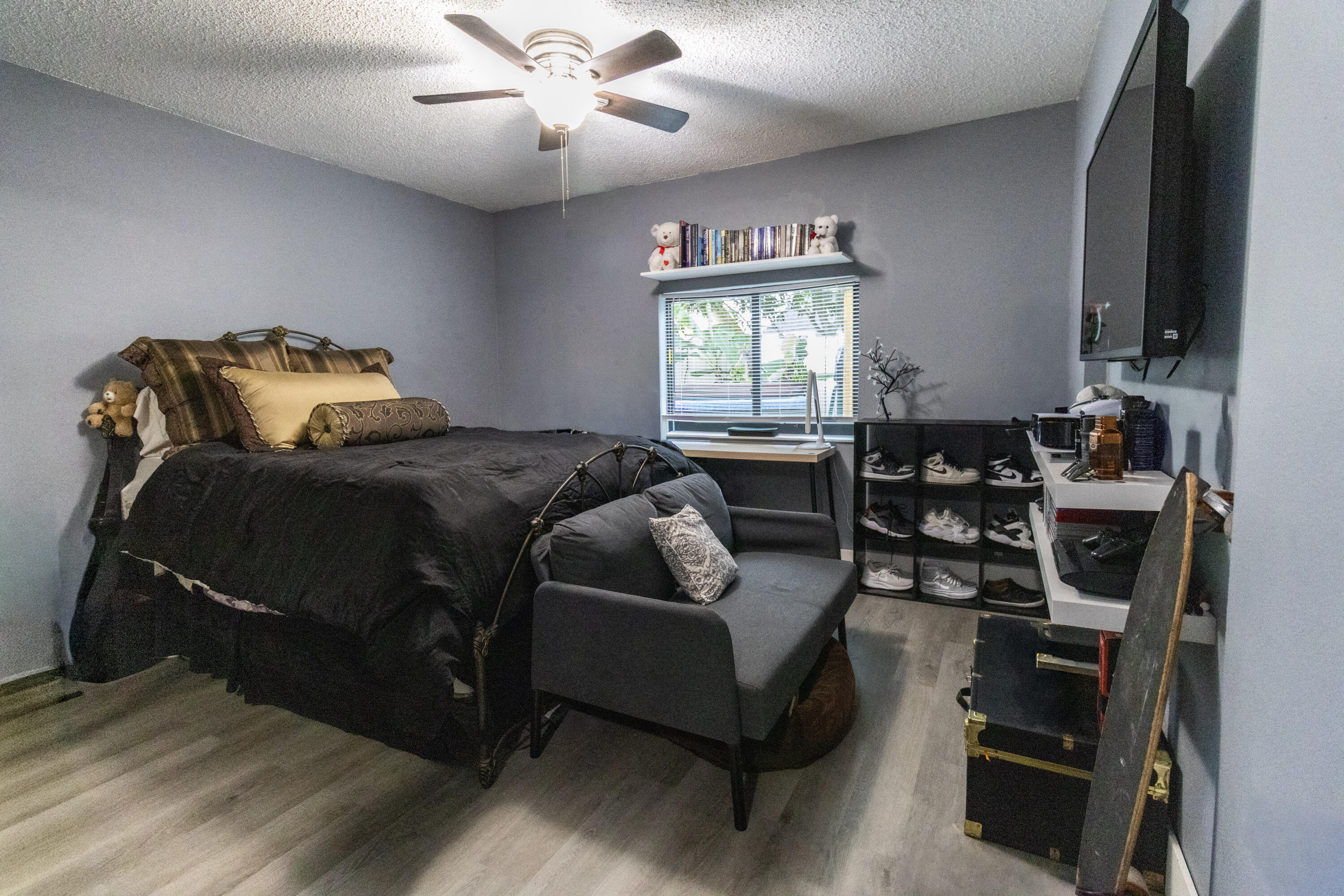 23287 Southwest 60th Avenue Boca Raton, FL 33428 - Photo 22 of 43 a bedroom with a bed and a window