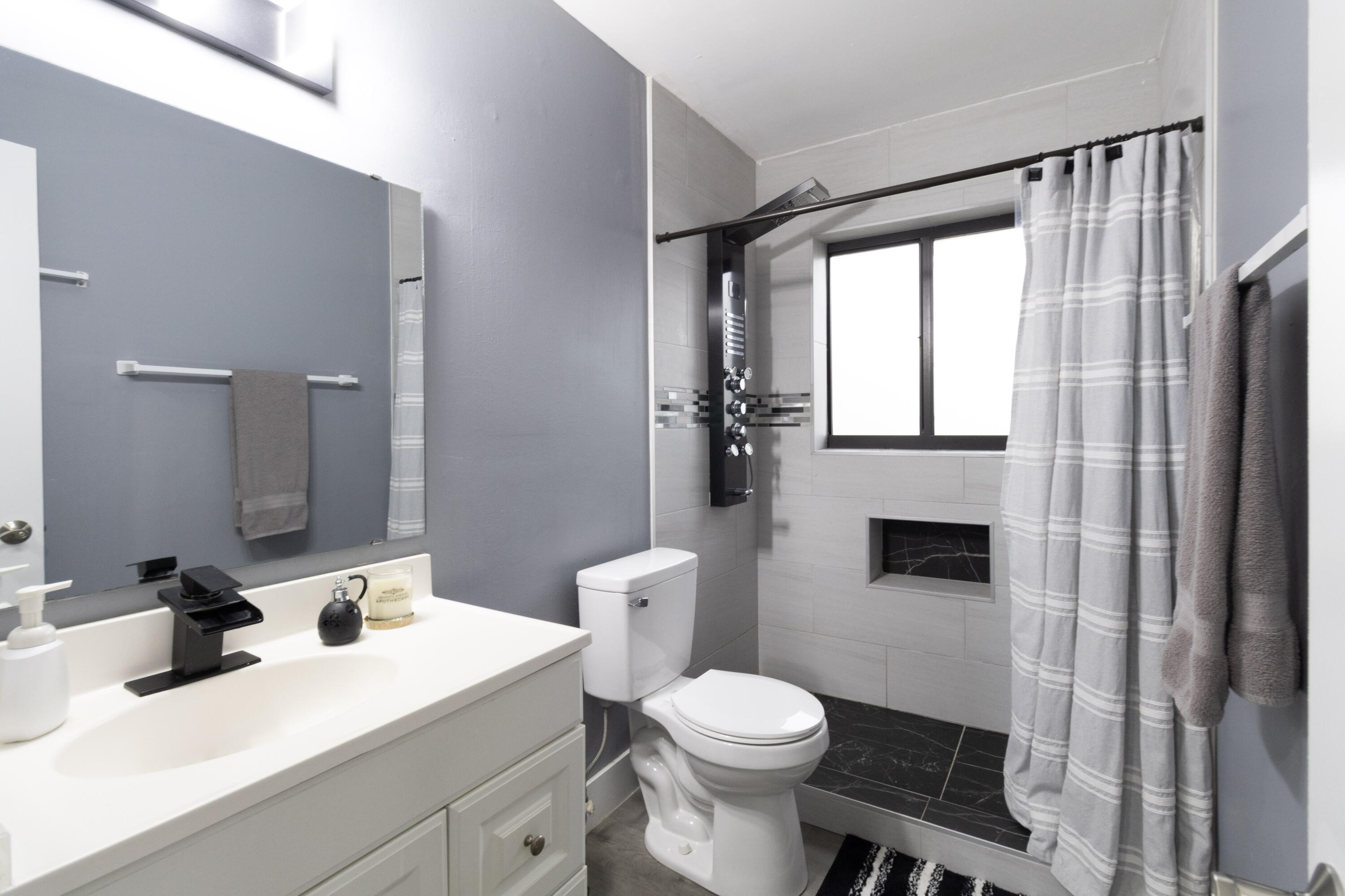 23287 Southwest 60th Avenue Boca Raton, FL 33428 - Photo 24 of 43 a bathroom with a toilet a sink and a mirror