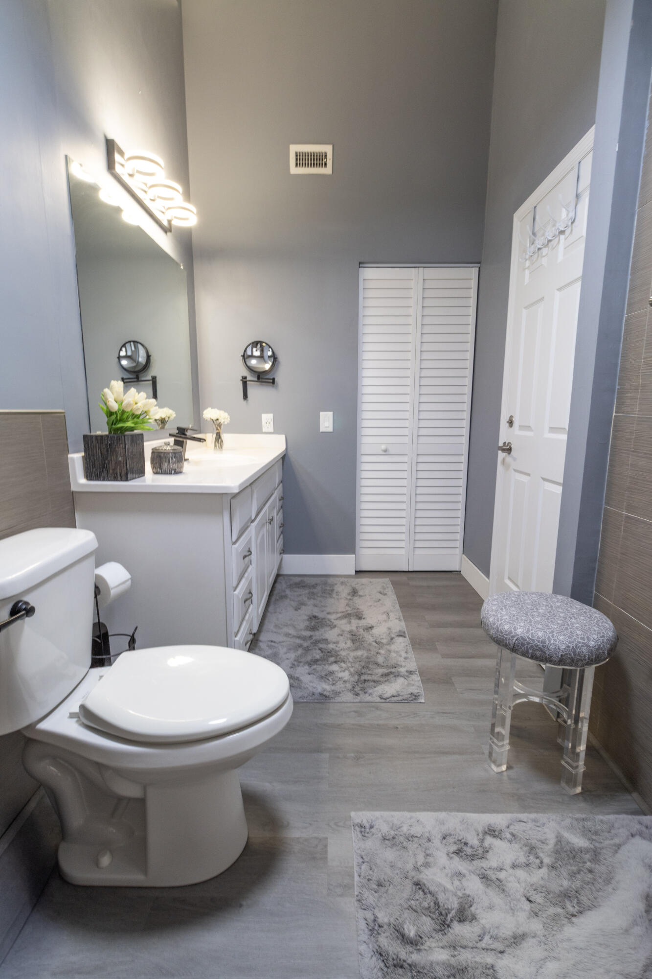 23287 Southwest 60th Avenue Boca Raton, FL 33428 - Photo 27 of 43 a bathroom with a toilet and a sink