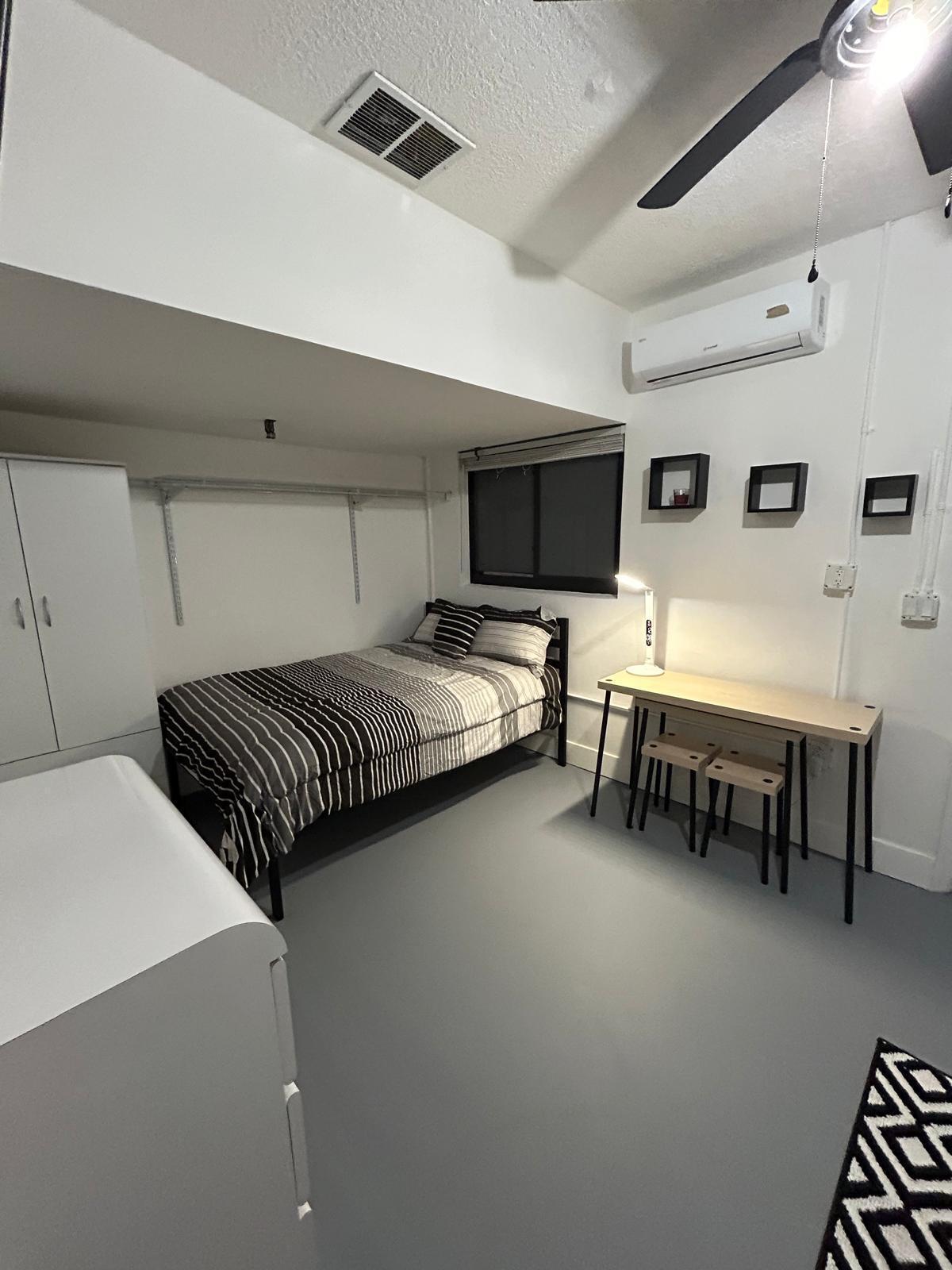 23287 Southwest 60th Avenue Boca Raton, FL 33428 - Photo 37 of 43 a bedroom with furniture and a chair