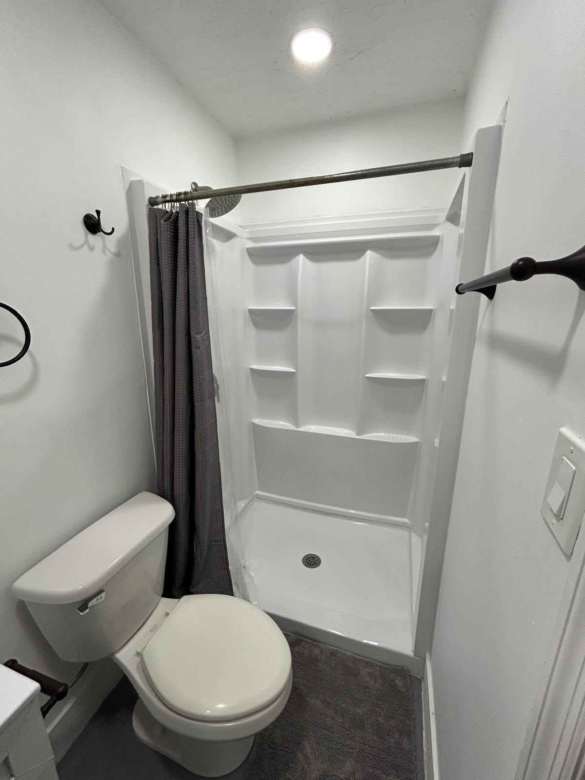 23287 Southwest 60th Avenue Boca Raton, FL 33428 - Photo 39 of 43 a bathroom with a toilet and a shower