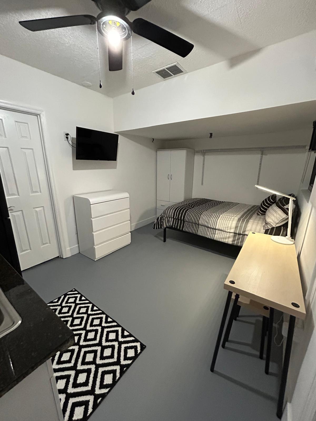 23287 Southwest 60th Avenue Boca Raton, FL 33428 - Photo 40 of 43 a kitchen with a sink a stove and a microwave