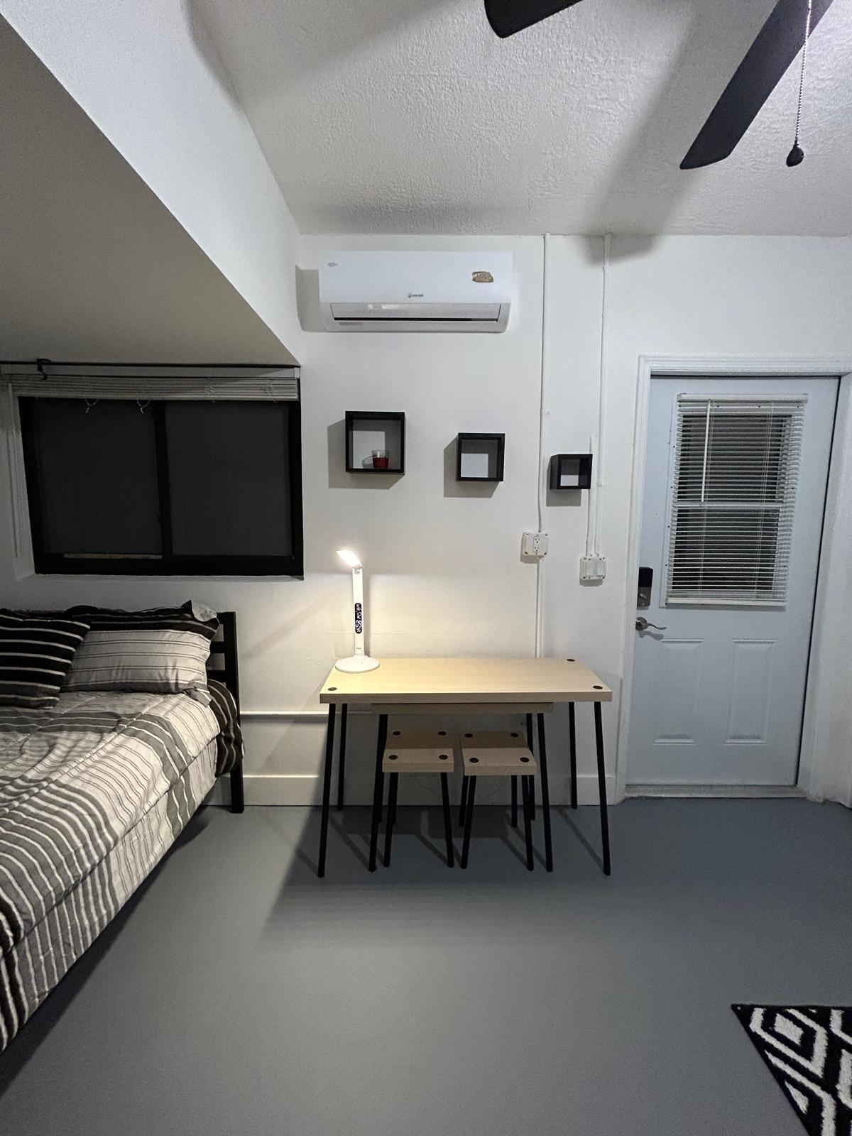 23287 Southwest 60th Avenue Boca Raton, FL 33428 - Photo 41 of 43 a spacious bedroom with a bed and a flat screen tv