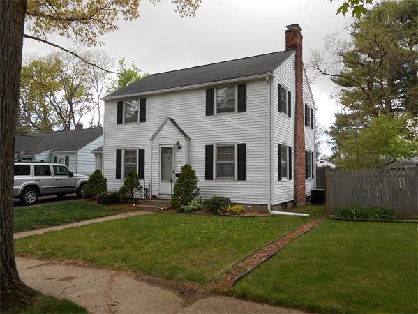 17 Dana Street Springfield, MA 01104 - Photo 1 of 12 a front view of a house with a yard and garage