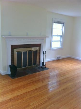 17 Dana Street Springfield, MA 01104 - Photo 2 of 12 an empty room with wooden floor and windows
