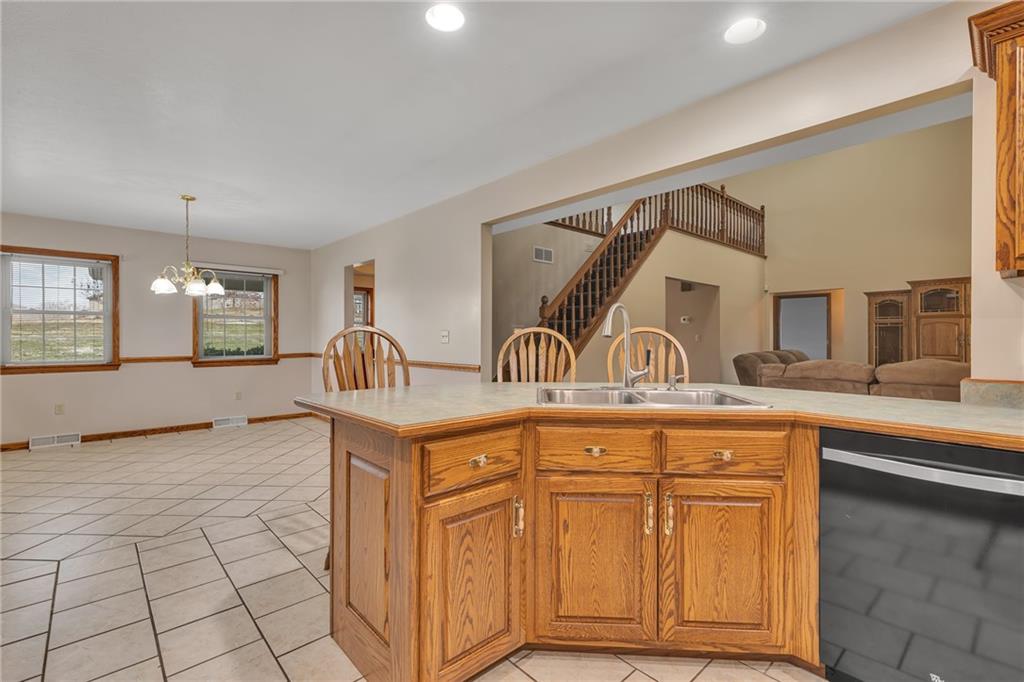 824 Old Millcreek Road Hookstown, PA 15050 - Photo 12 of 35 a view of a sink and dishwasher with wooden floor