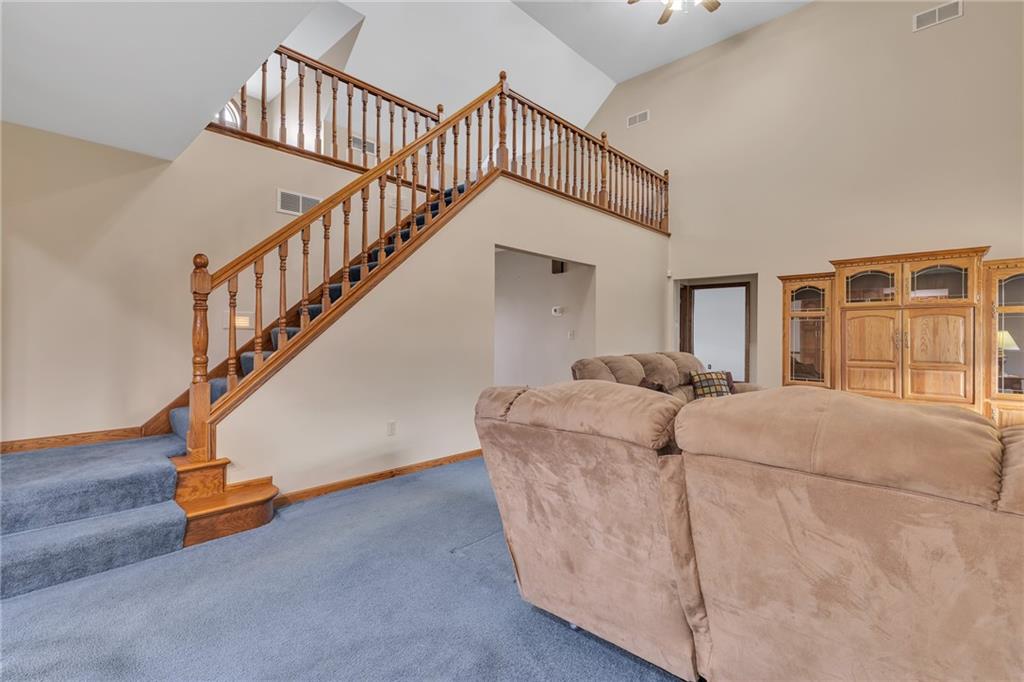 824 Old Millcreek Road Hookstown, PA 15050 - Photo 15 of 35 a living room with furniture and stairs
