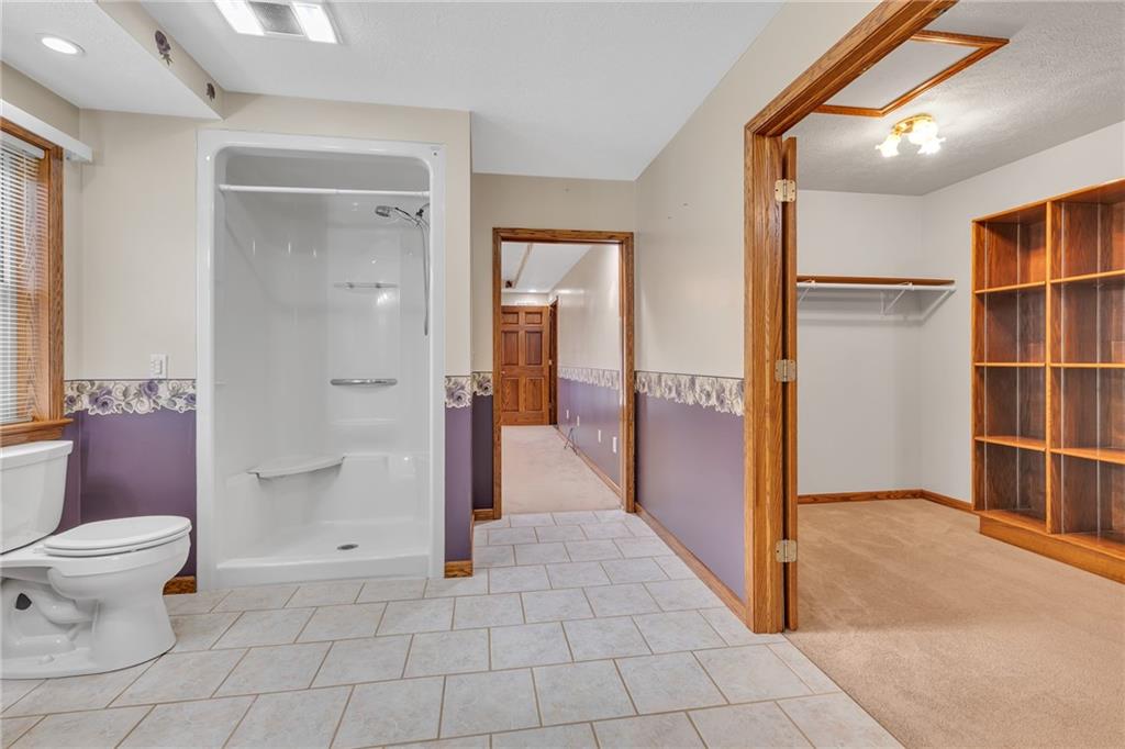 824 Old Millcreek Road Hookstown, PA 15050 - Photo 21 of 35 a bathroom with a glass door shower a toilet and a sink