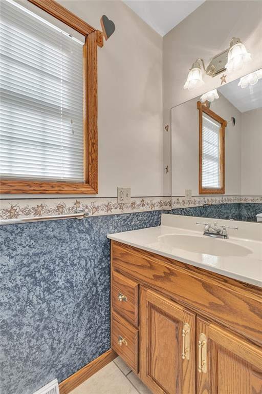 824 Old Millcreek Road Hookstown, PA 15050 - Photo 28 of 35 a bathroom with a granite countertop sink and a mirror