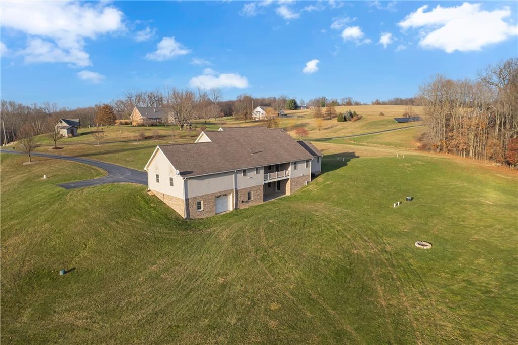 824 Old Millcreek Road Hookstown, PA 15050 - Photo 32 of 35 a view of a big room with swimming pool and mountains in the background