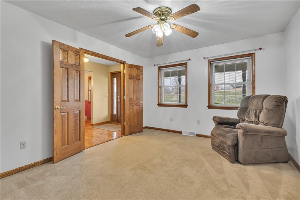 824 Old Millcreek Road Hookstown, PA 15050 - Photo 5 of 35 a living room with furniture and a chandelier