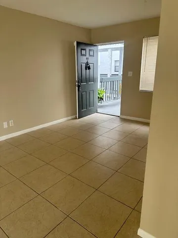 a view of hallway with livingroom and hallway