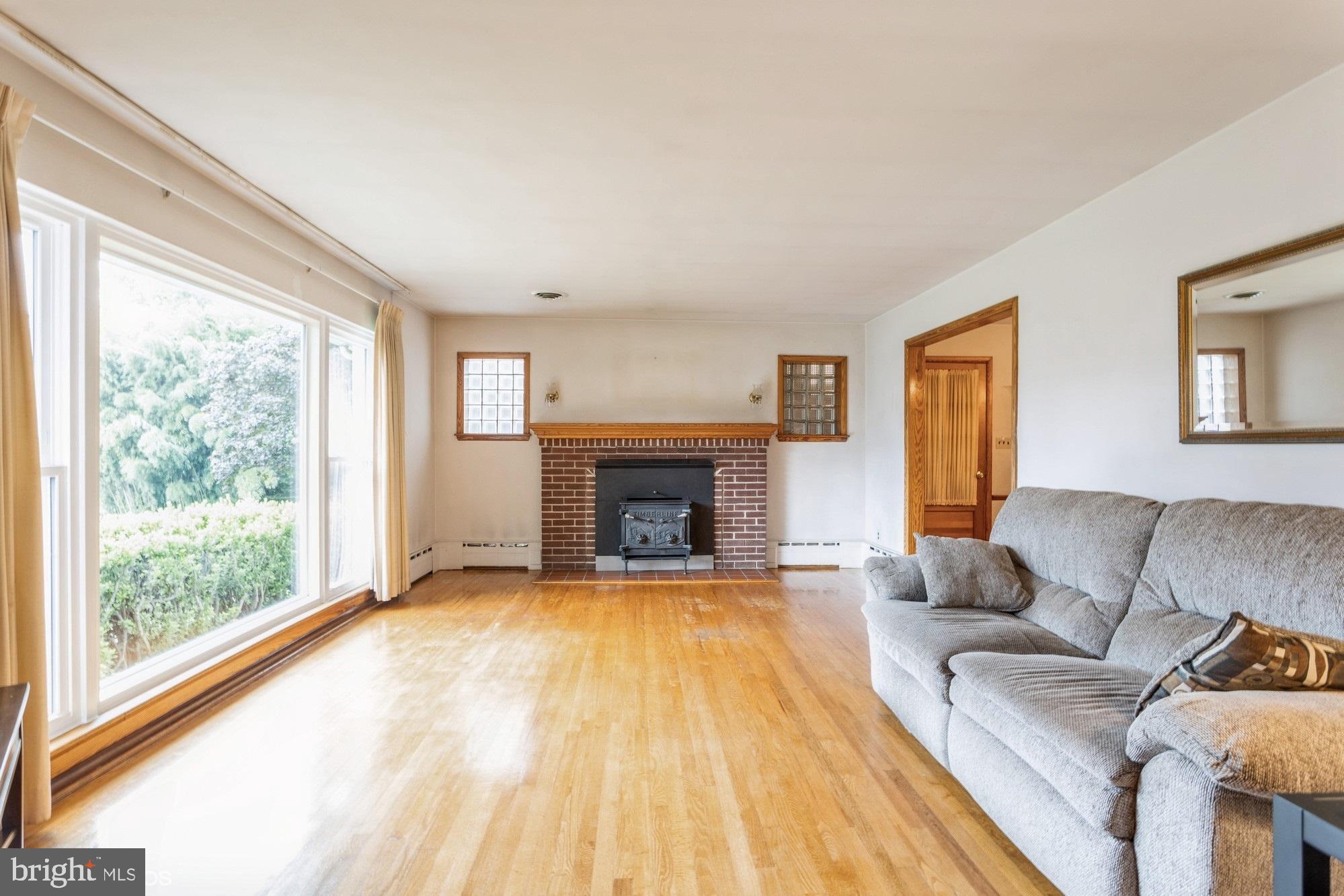 505 Whitaker Mill Road Fallston, MD 21047 - Photo 5 of 49 a living room with furniture and a fireplace
