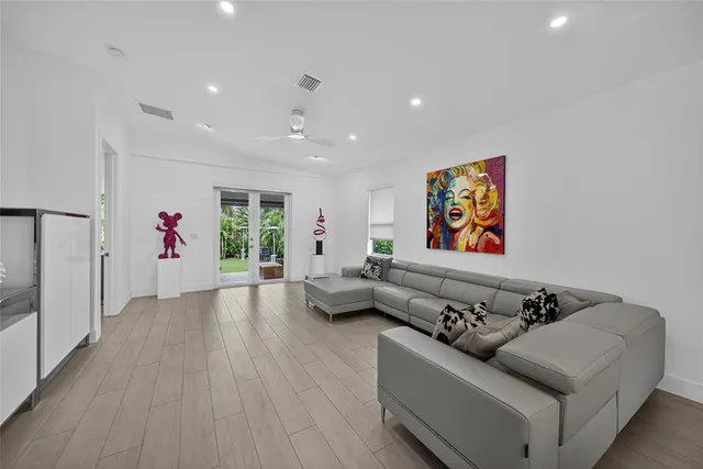 a living room with furniture and window