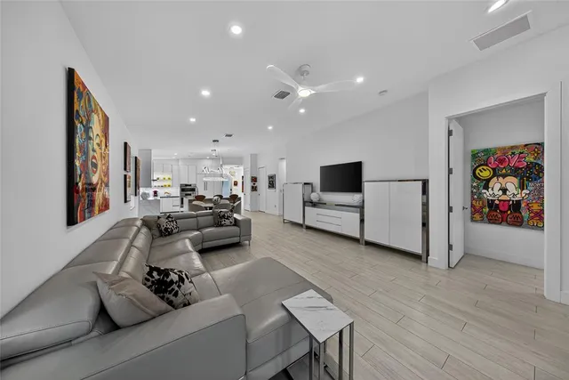 a living room with furniture and white walls