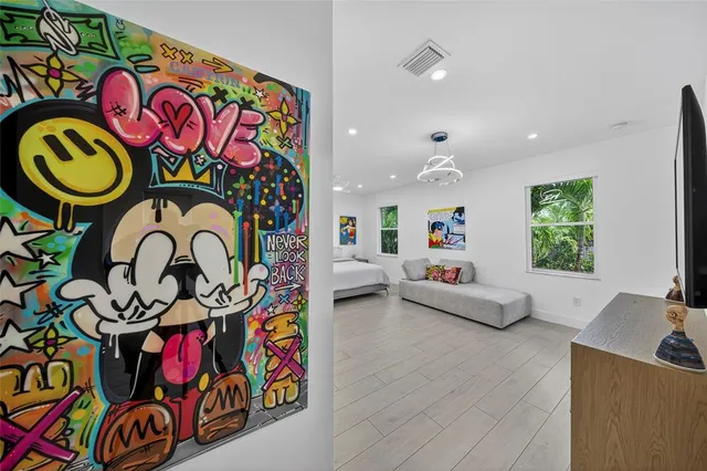 a living room with fireplace furniture and a window