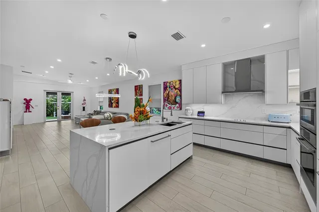 a kitchen with a sink and cabinets