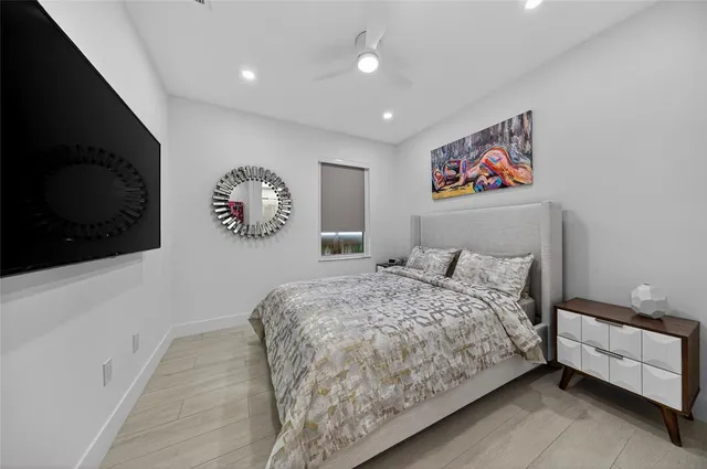 a bed room with a bed and a television