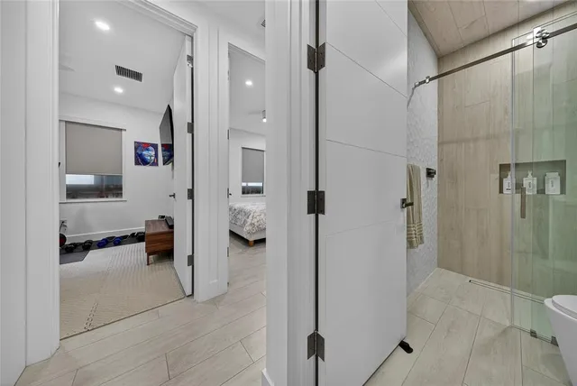 a bathroom with a shower and a sink