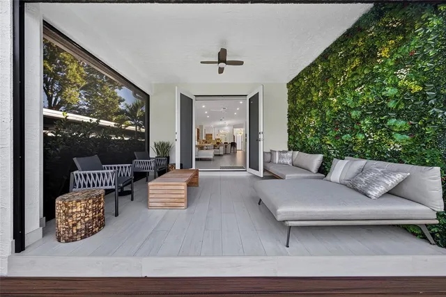 a view of a house with backyard and a garden