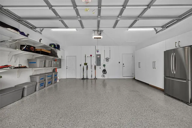 a front view of a house with a yard and a garage