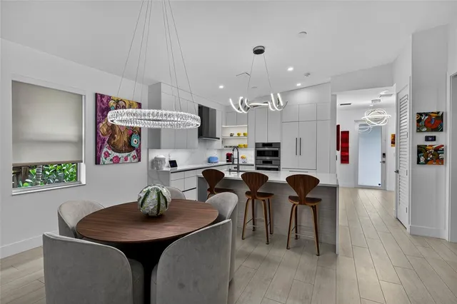 a view of kitchen and dining area with furniture