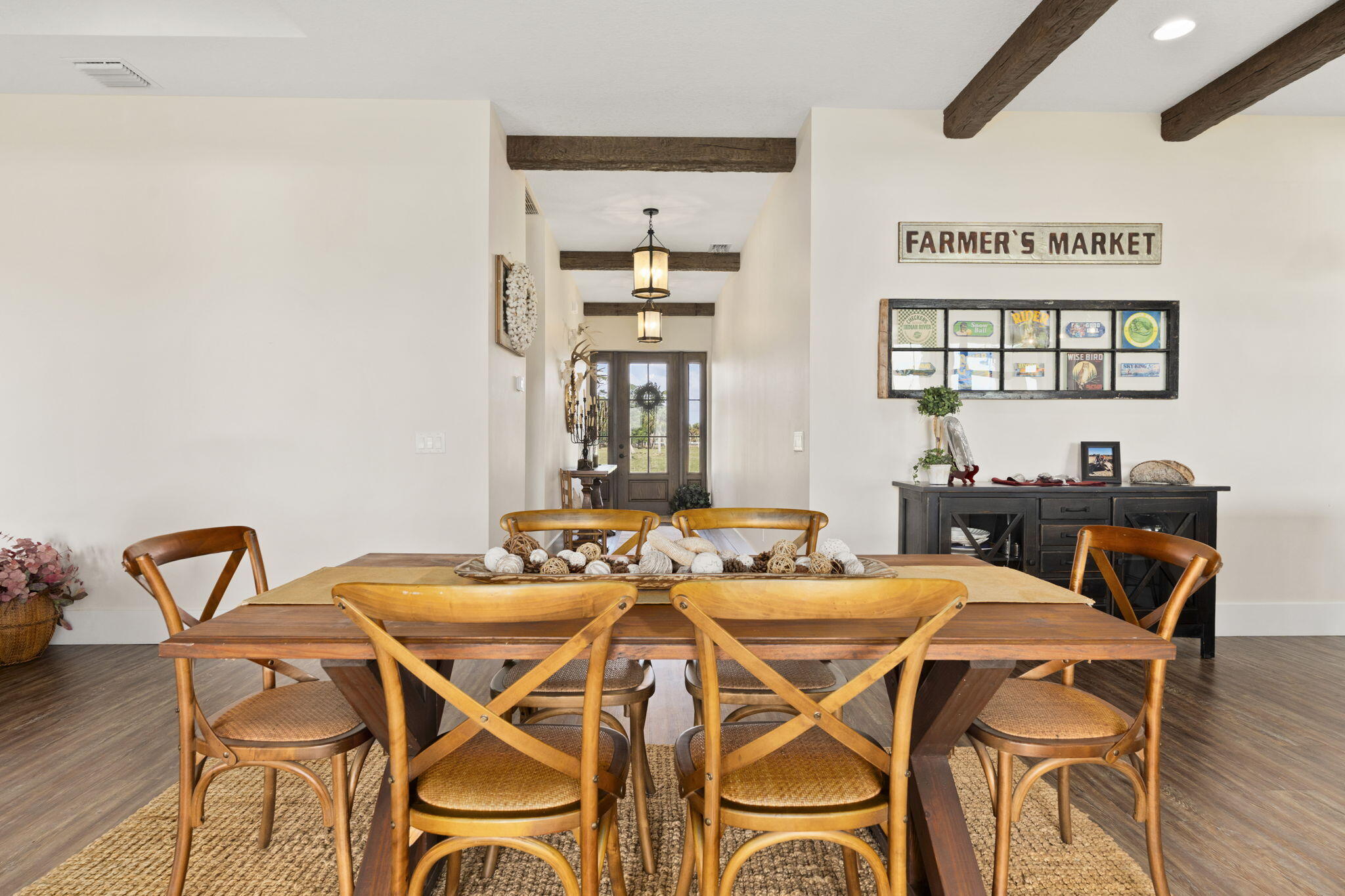 1720 South Brocksmith Road Fort Pierce, FL 34945 - Photo 11 of 53 a view of a dining room with furniture and wooden floor