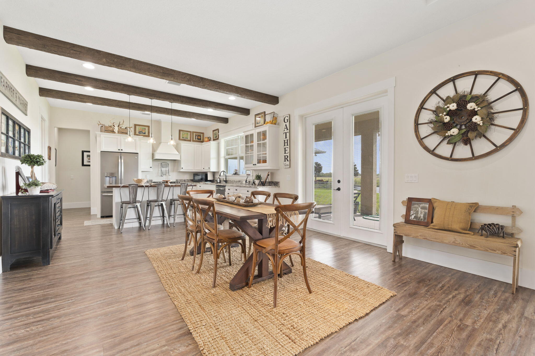 1720 South Brocksmith Road Fort Pierce, FL 34945 - Photo 12 of 53 a view of a dining room with furniture window and wooden floor