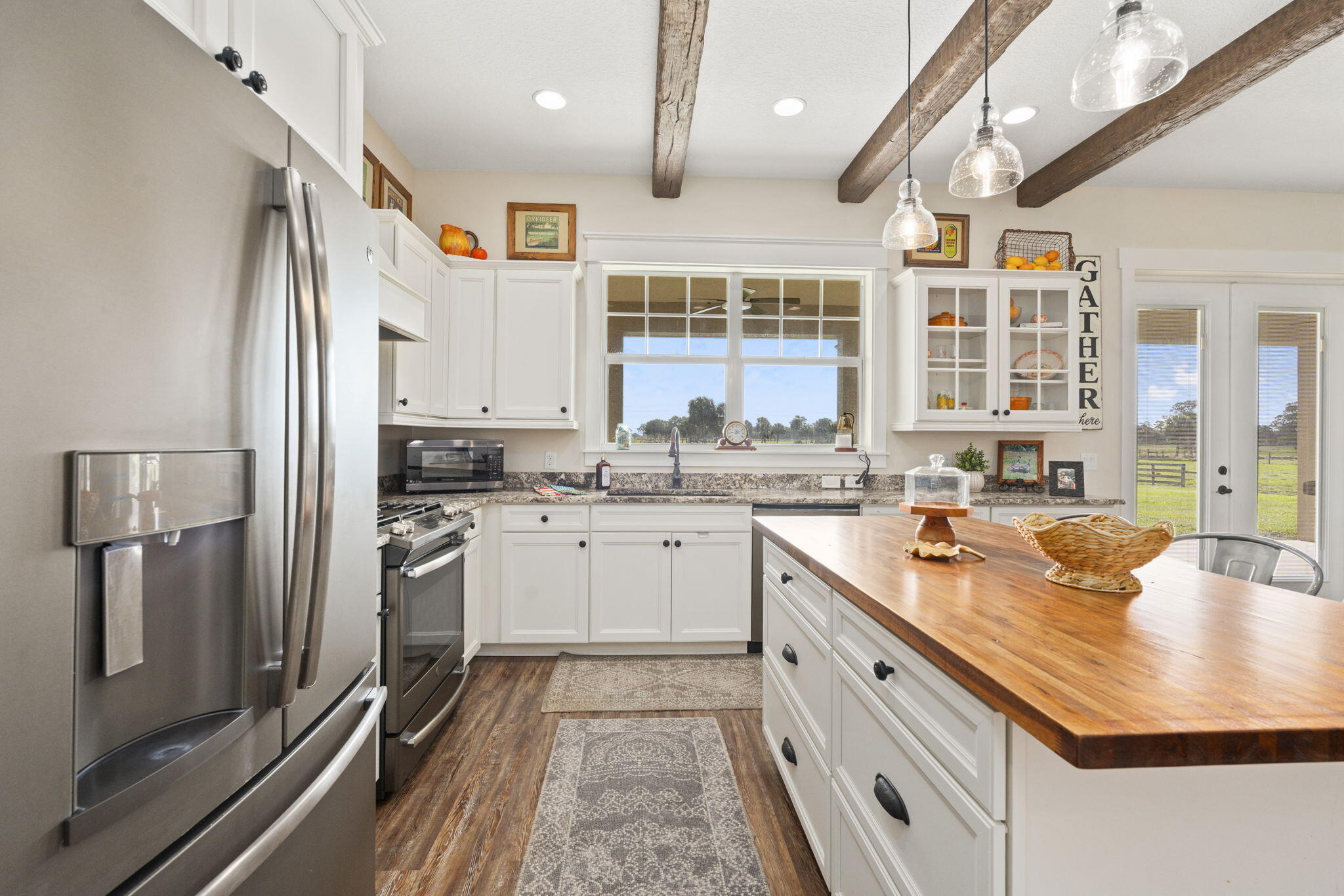 1720 South Brocksmith Road Fort Pierce, FL 34945 - Photo 15 of 53 a open kitchen with stainless steel appliances granite countertop a sink stove and refrigerator