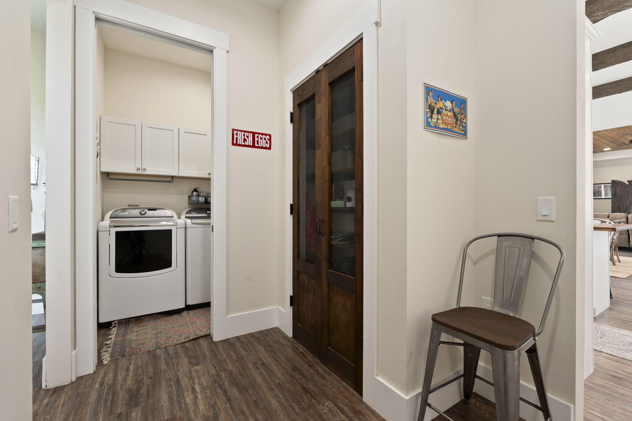 1720 South Brocksmith Road Fort Pierce, FL 34945 - Photo 18 of 53 a view of a hallway with wooden floor and cabinet