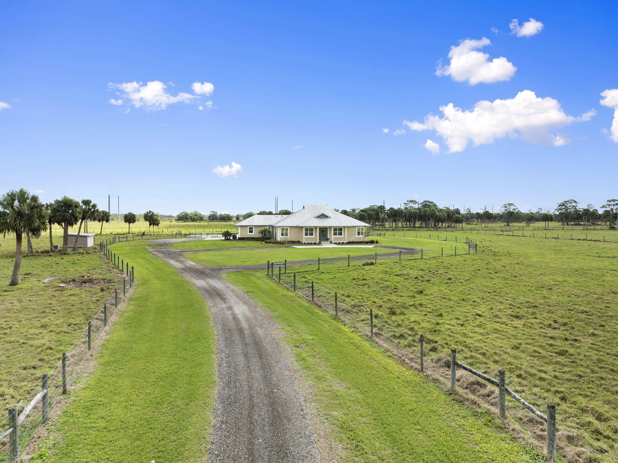 1720 South Brocksmith Road Fort Pierce, FL 34945 - Photo 2 of 53 a view of a lake with a big yard