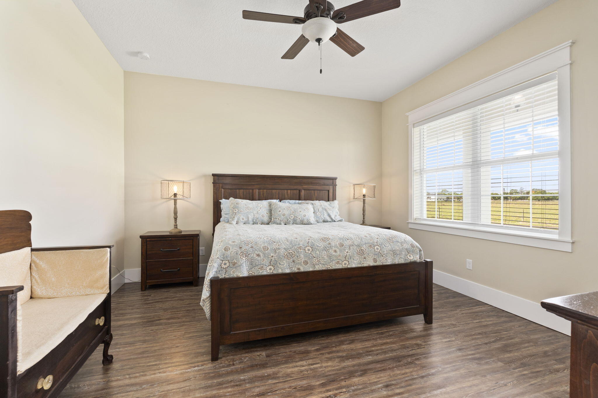 1720 South Brocksmith Road Fort Pierce, FL 34945 - Photo 23 of 53 a bedroom with a bed and wooden floor