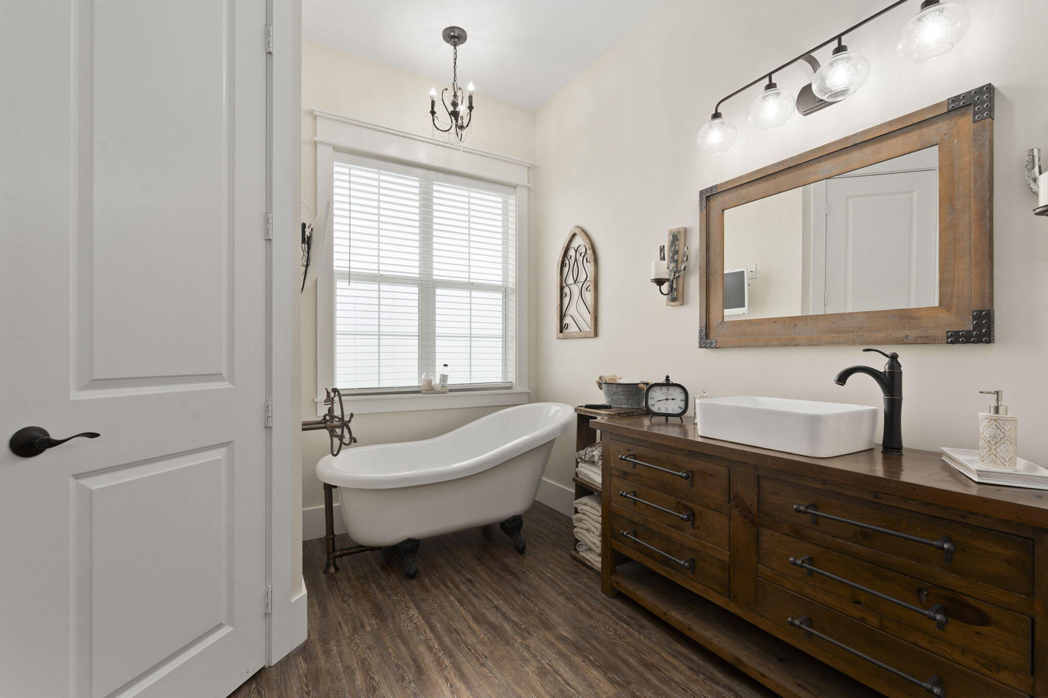 1720 South Brocksmith Road Fort Pierce, FL 34945 - Photo 26 of 53 a spacious bathroom with a double vanity sink a mirror and a bathtub