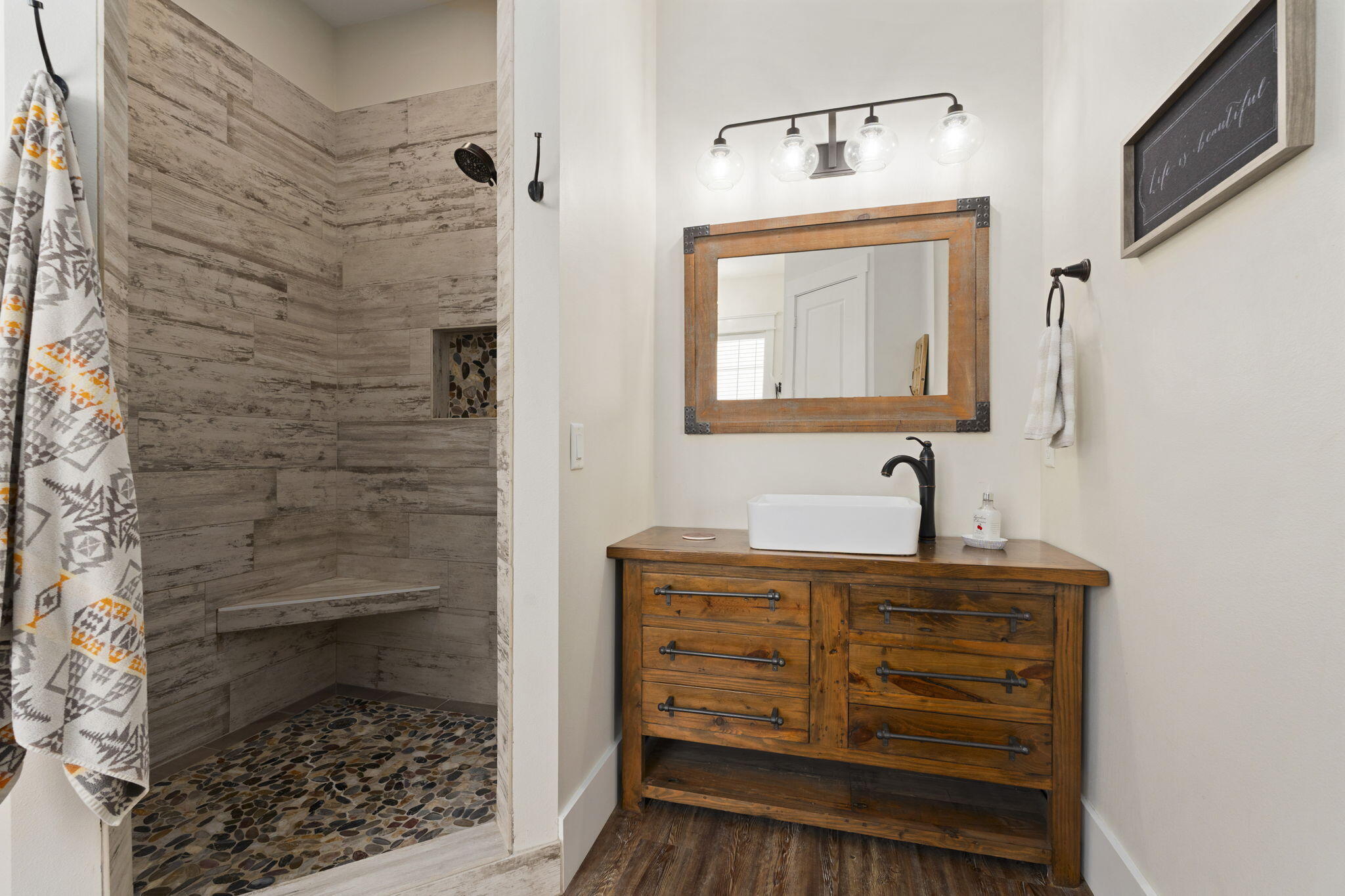 1720 South Brocksmith Road Fort Pierce, FL 34945 - Photo 28 of 53 a bathroom with a granite countertop sink a vanity and a shower