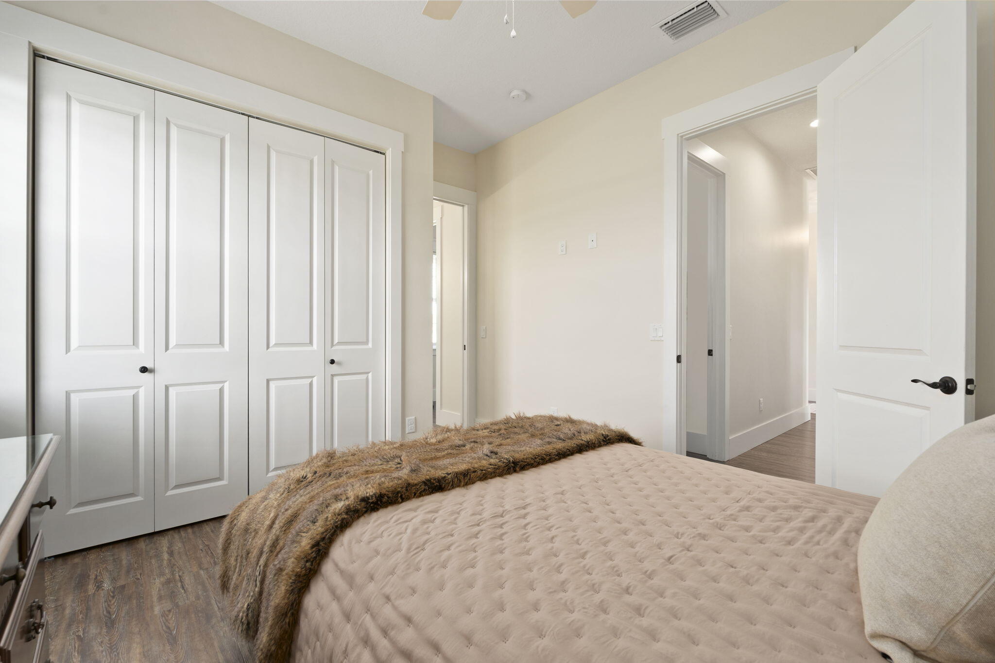 1720 South Brocksmith Road Fort Pierce, FL 34945 - Photo 32 of 53 a bedroom with a bed and a mirror