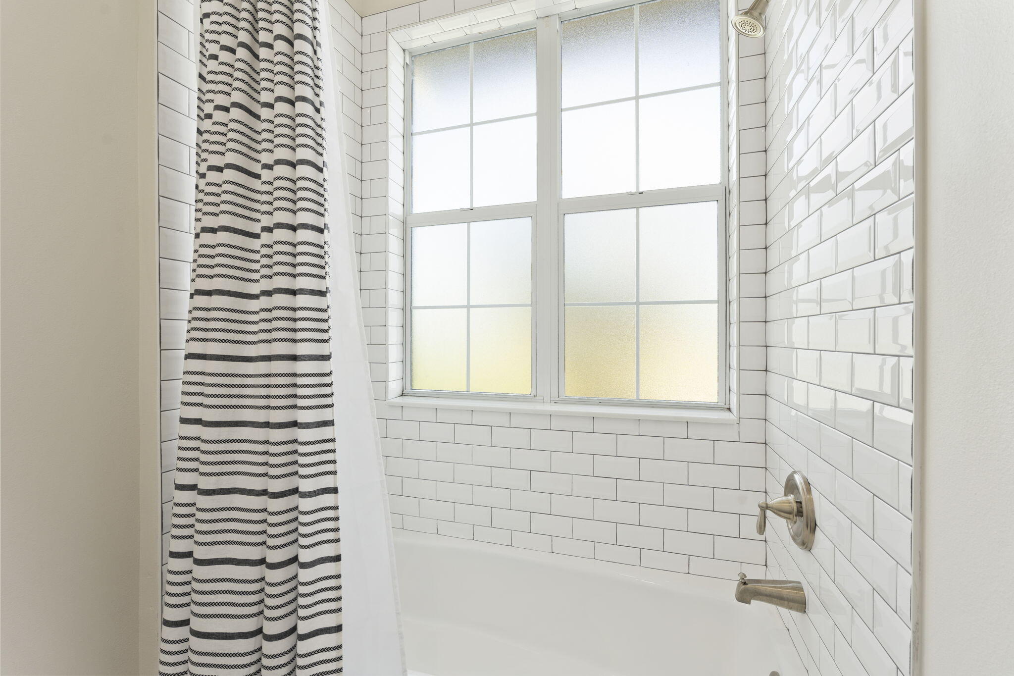 1720 South Brocksmith Road Fort Pierce, FL 34945 - Photo 35 of 53 a bathroom with a bathtub and next to a window