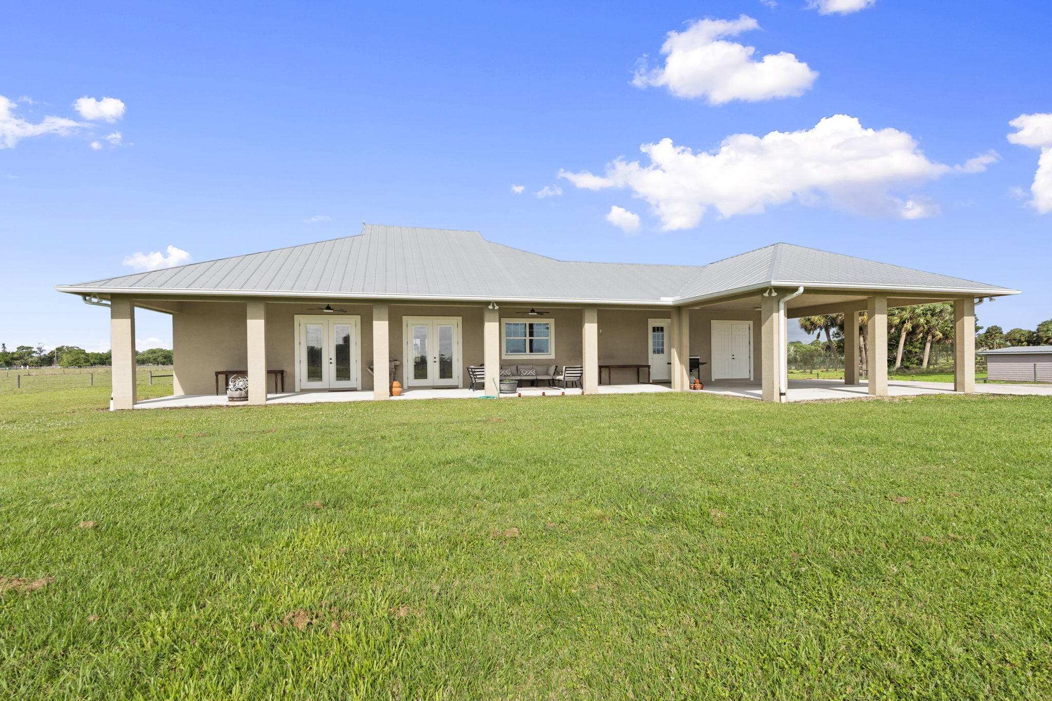 1720 South Brocksmith Road Fort Pierce, FL 34945 - Photo 39 of 53 a view of a house with a garden