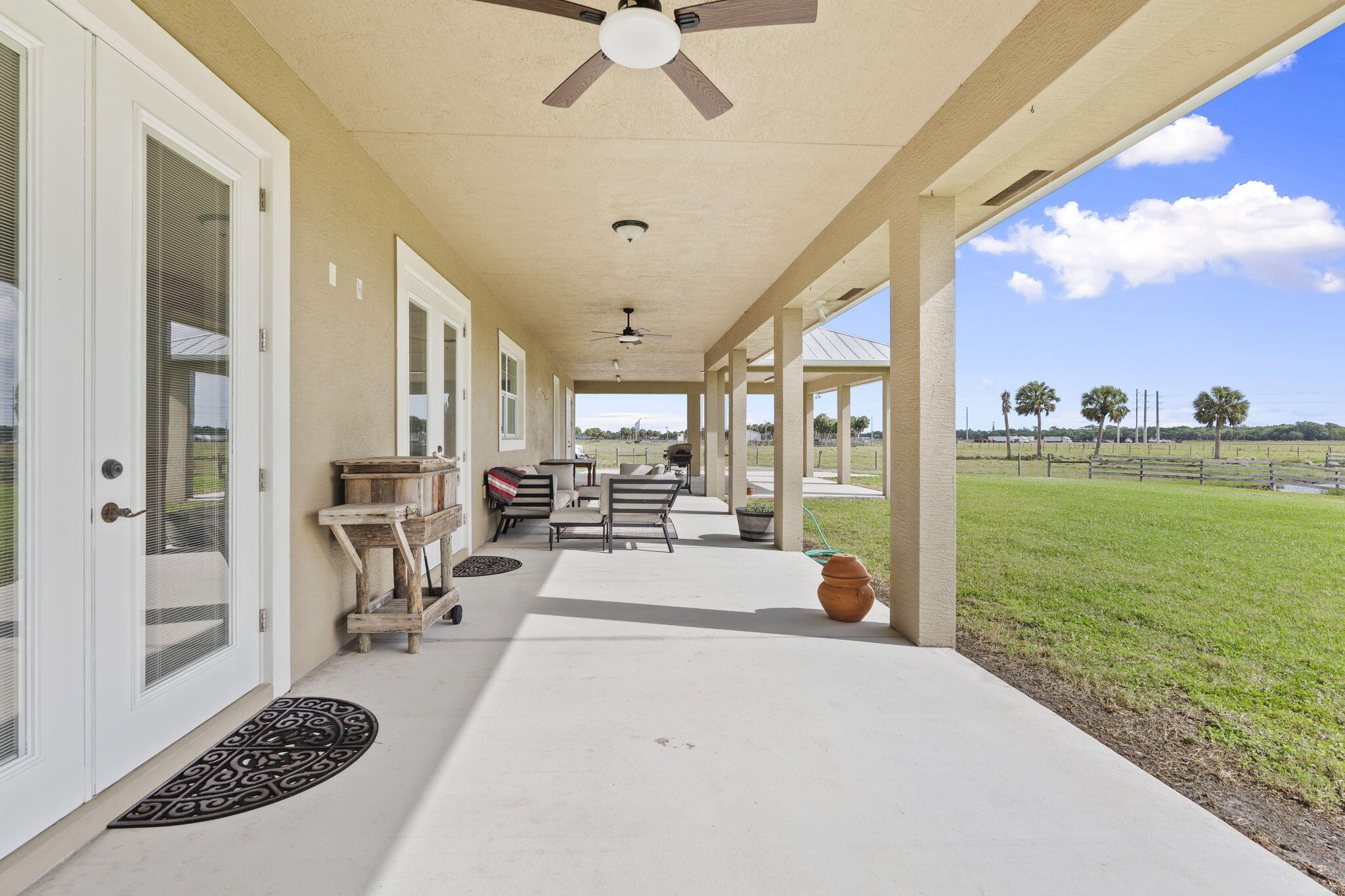 1720 South Brocksmith Road Fort Pierce, FL 34945 - Photo 41 of 53 a view of a living room and a floor to ceiling window