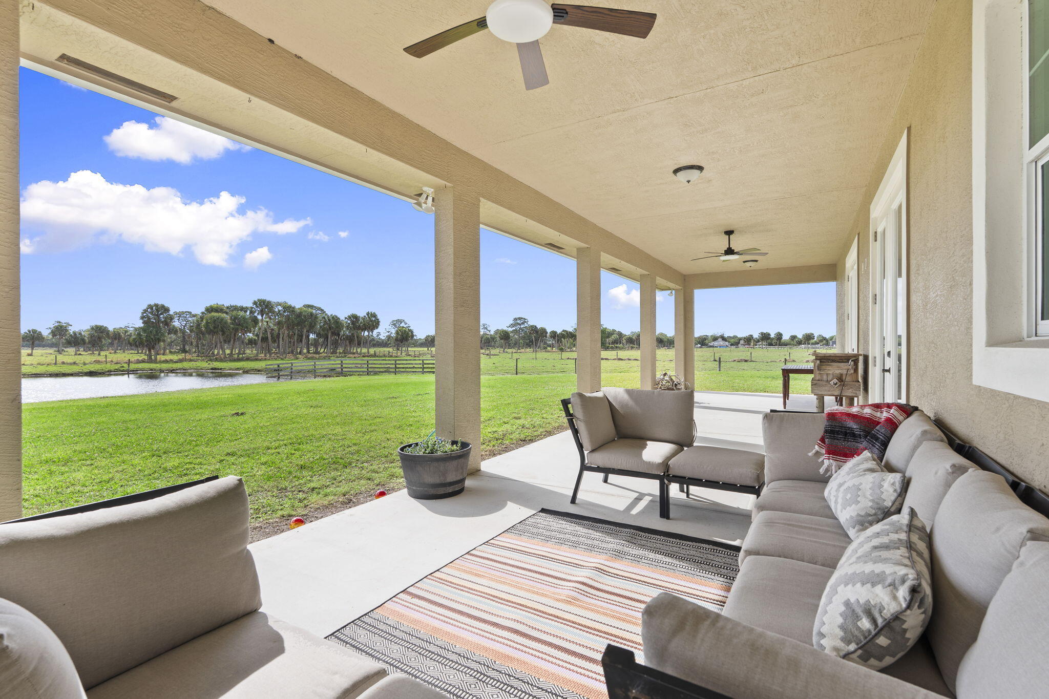 1720 South Brocksmith Road Fort Pierce, FL 34945 - Photo 42 of 53 a balcony with furniture and city view
