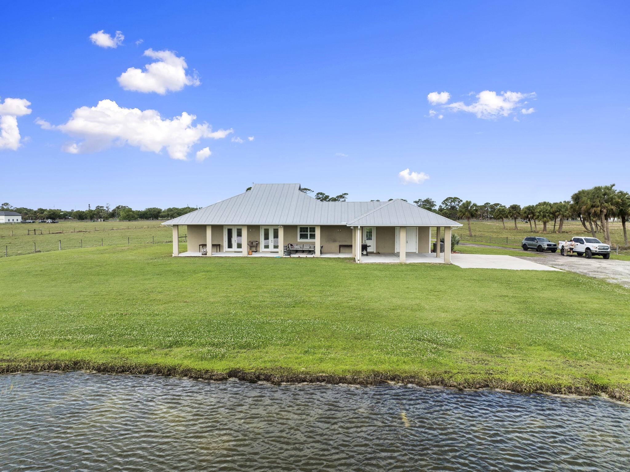 1720 South Brocksmith Road Fort Pierce, FL 34945 - Photo 46 of 53 a front view of a house with a garden