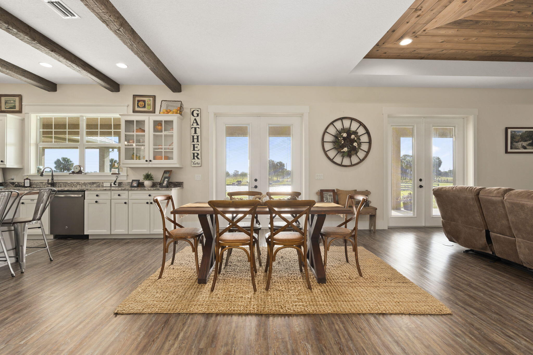 1720 South Brocksmith Road Fort Pierce, FL 34945 - Photo 10 of 53 a view of a dining room with furniture window and wooden floor