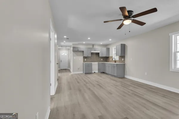 a view of kitchen with wooden floor and window